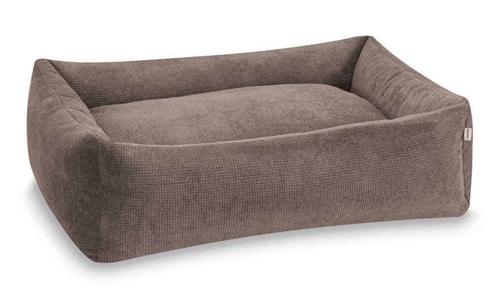 Brown pet bed on a white background